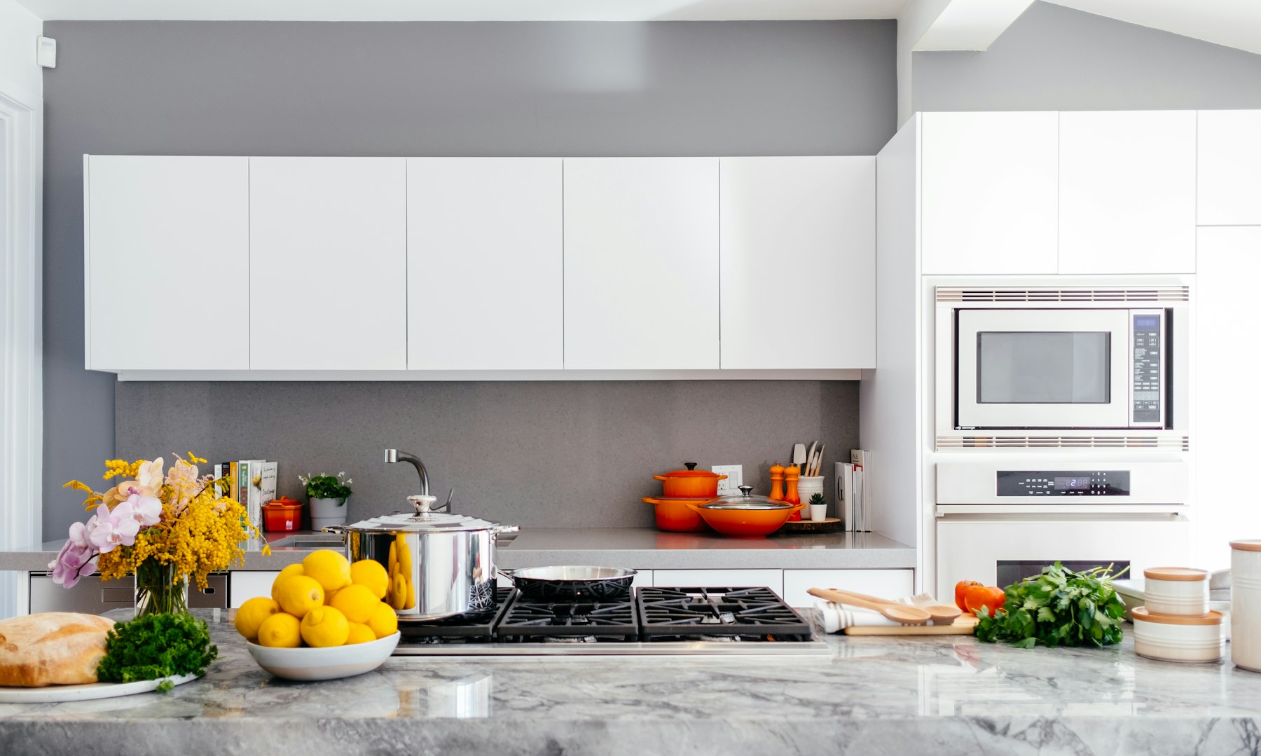 A bright home kitchen with cooking appliances and fresh food